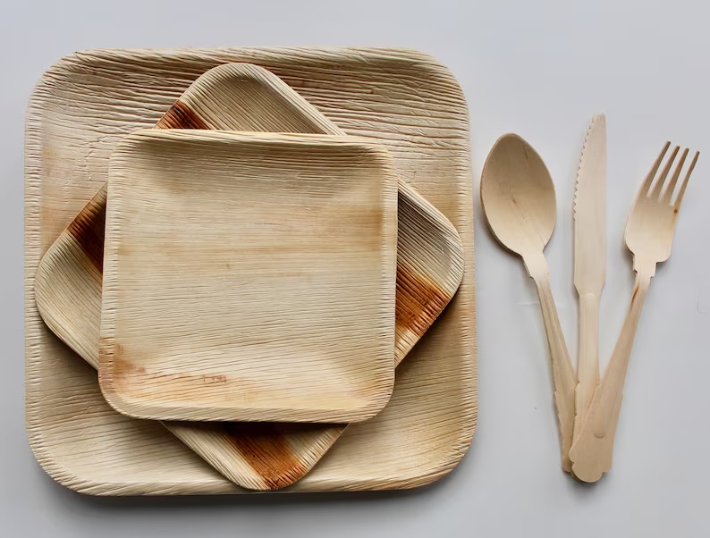 NZR's complete BioWare set — palm-leaf plates and bamboo cutlery, all compostable.