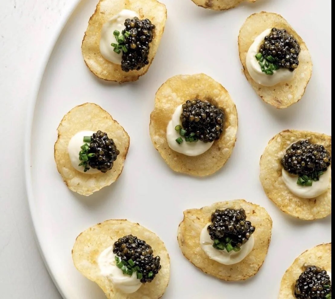 Sturgeon caviar on house-fried potato chips with crème fraîche and chives.