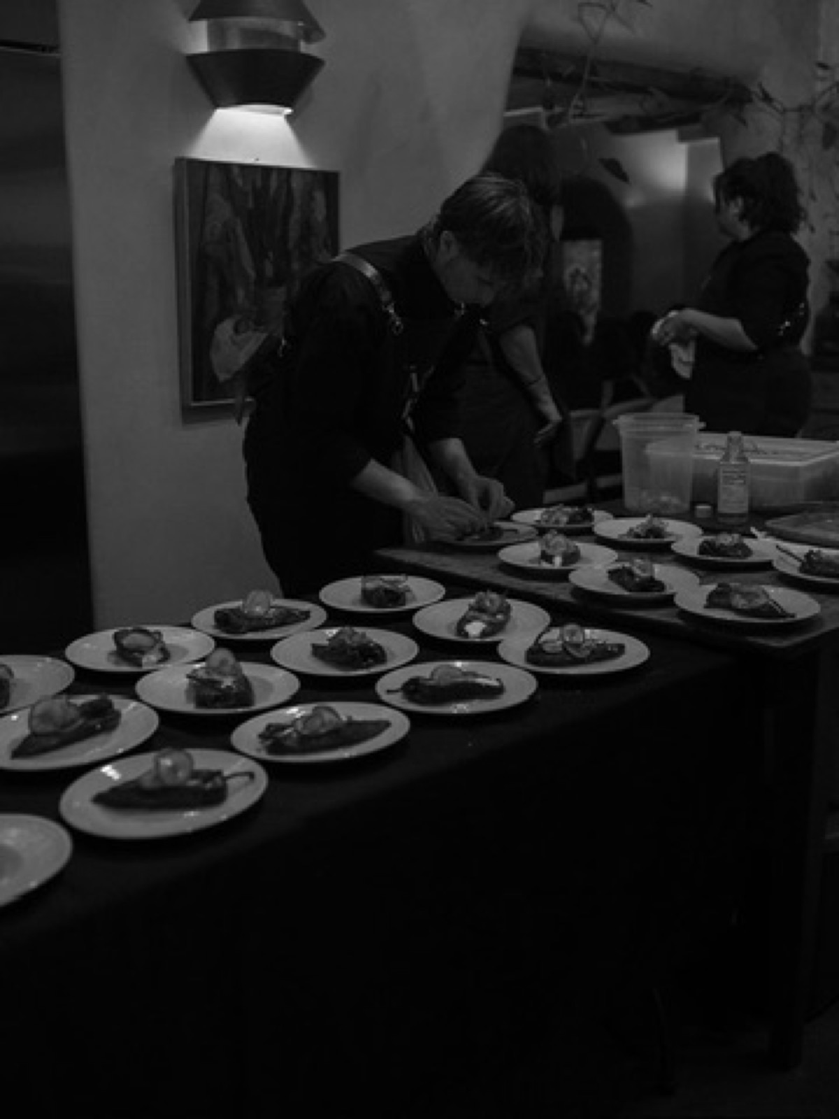 The Net Zero Ranch crew plating a course, in black and white.
