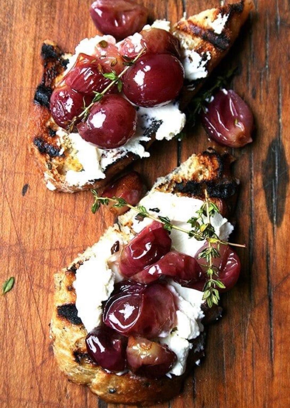 Styled photo representing Net Zero Ranch's grape & goat-cheese bruschetta.