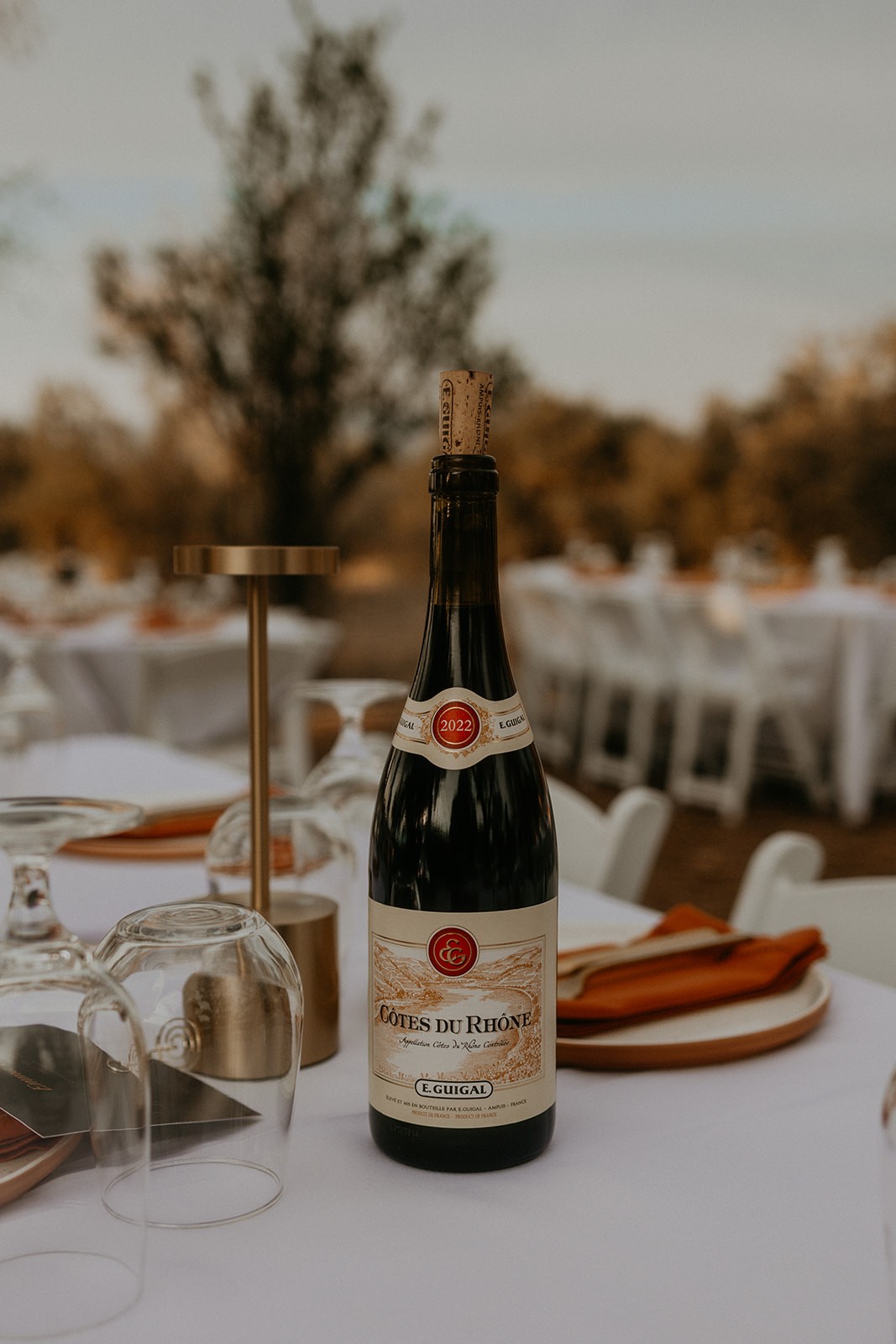 Wine and glasses at a Net Zero Ranch place setting — the wine table.