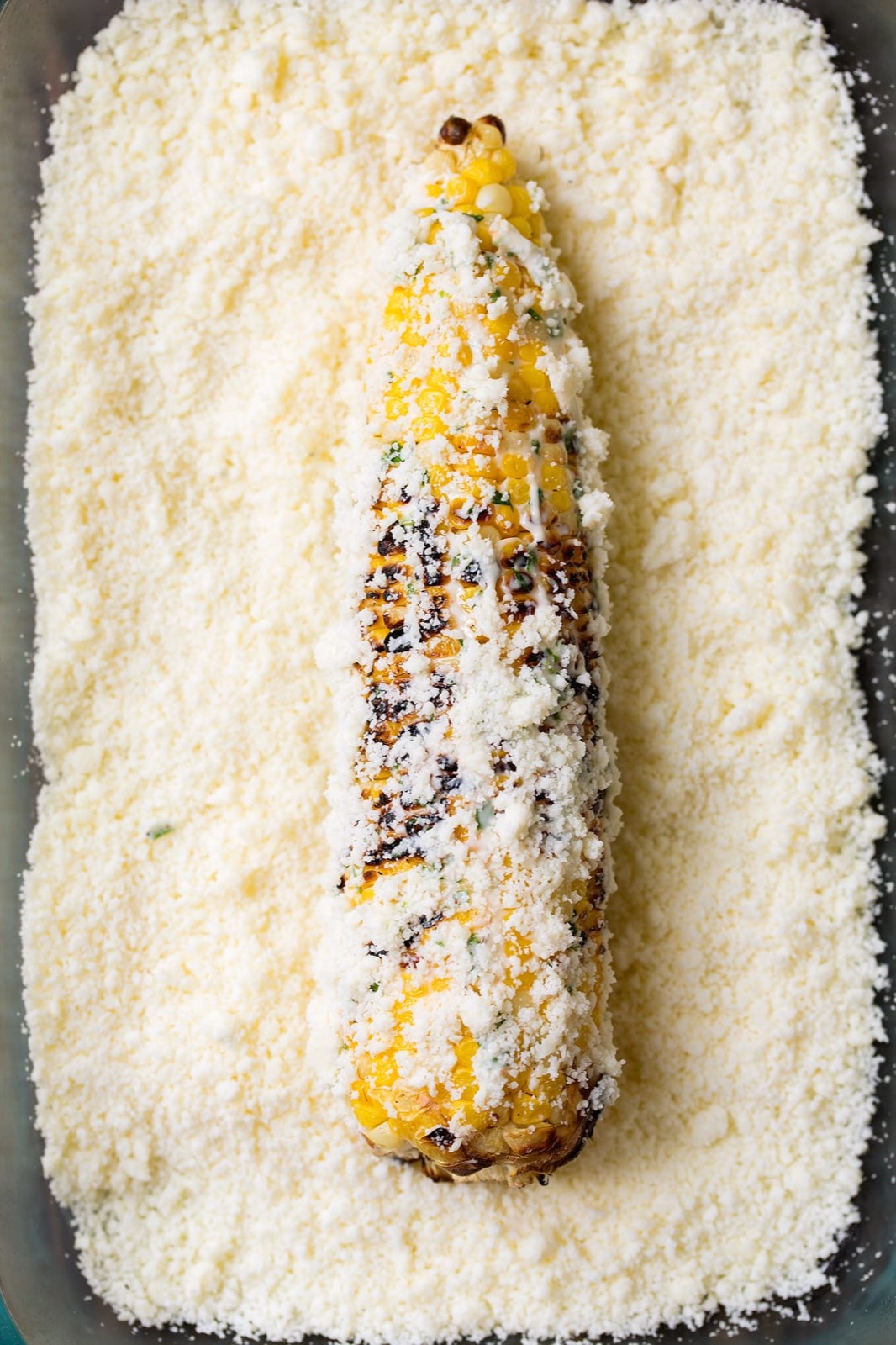 Grilled elote with cotija — The Charro table.