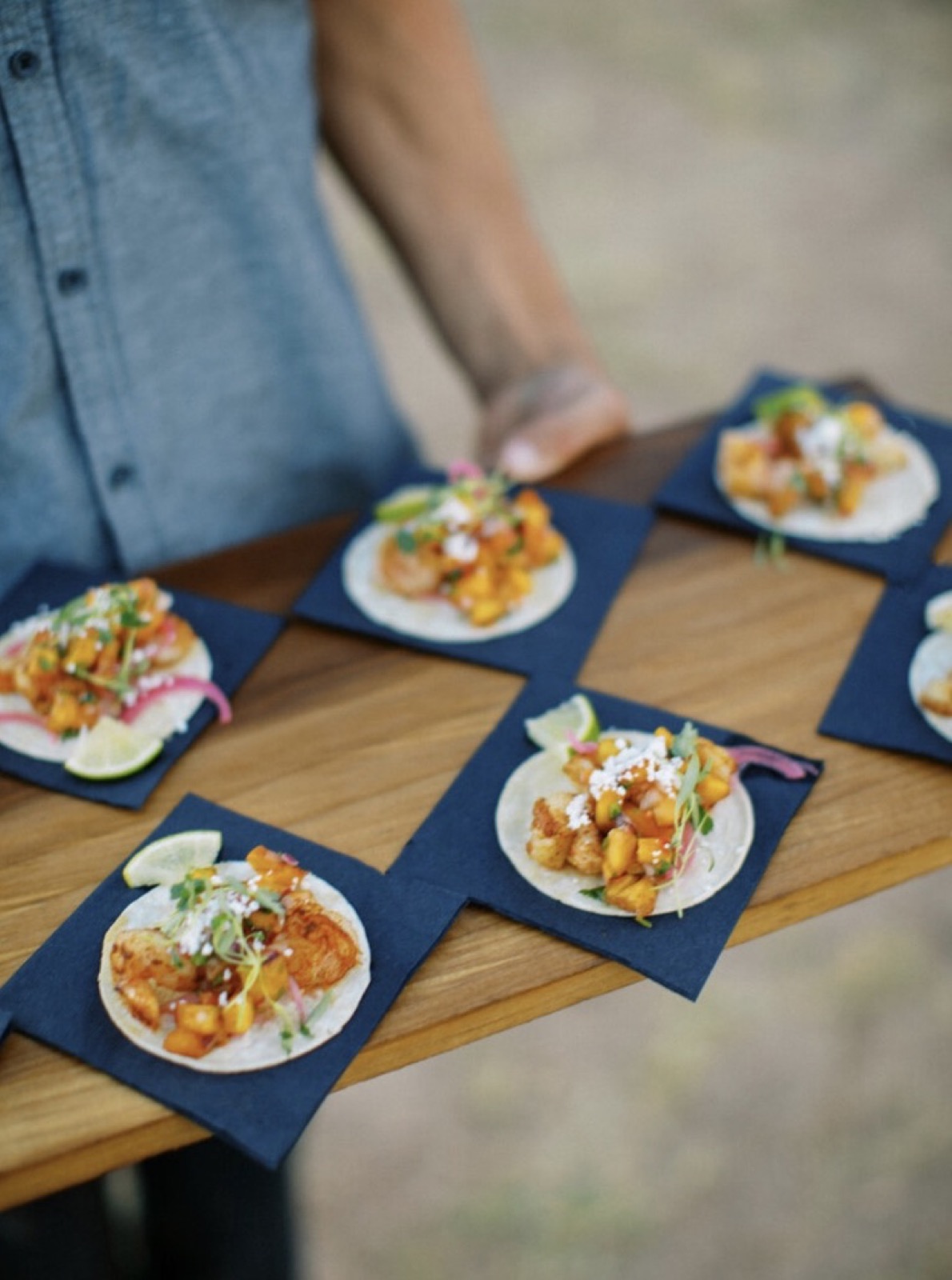 Peach shrimp taco plated on slate — appetizer station.