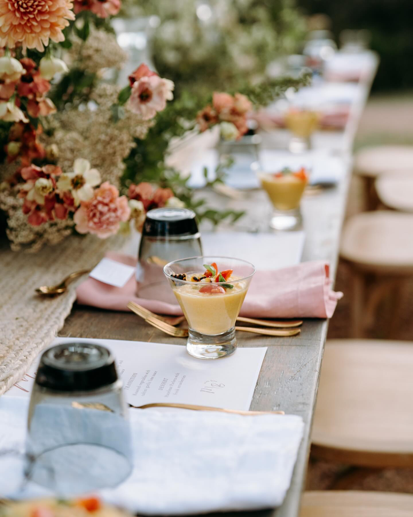 A plated, seated Net Zero Ranch dinner tablescape set for a wine pairing dinner.