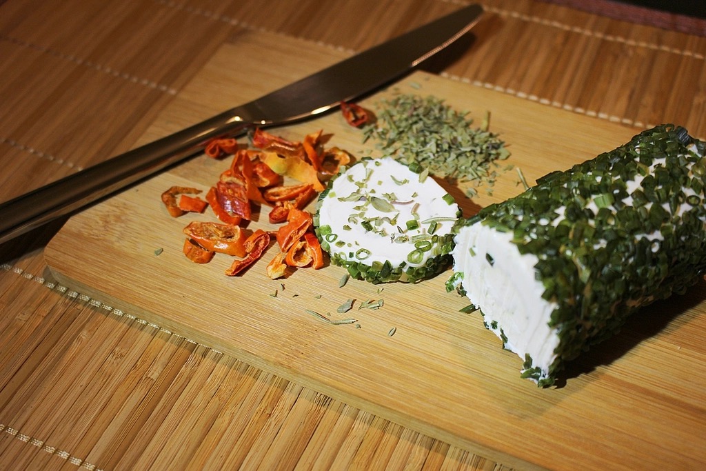 Fresh local goat cheese on a wooden board