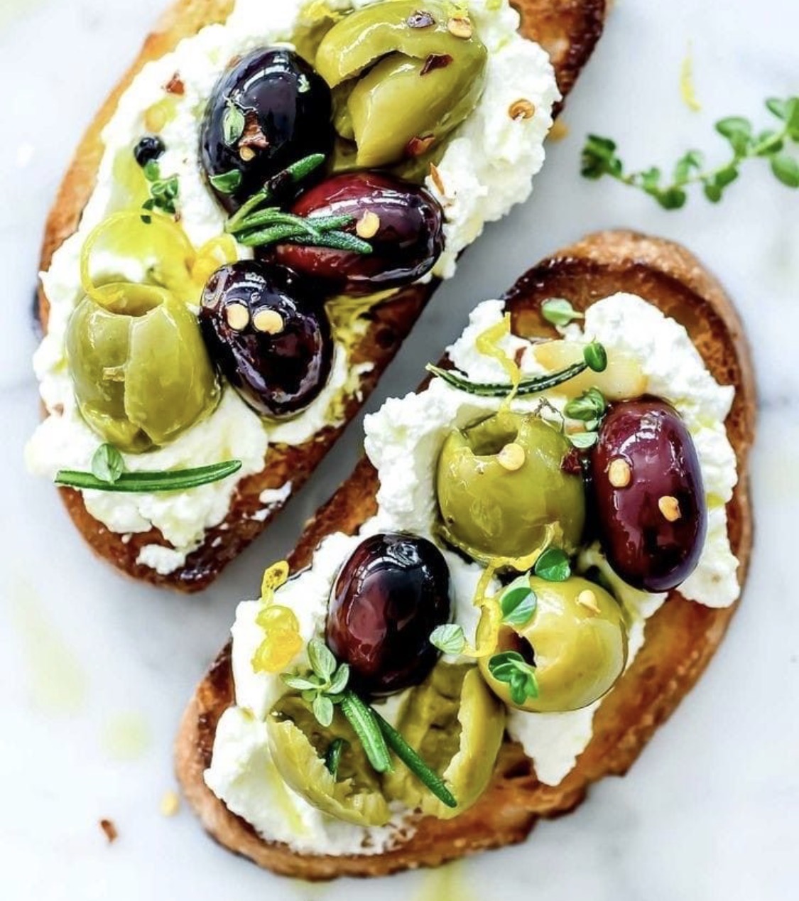 Olive and ricotta crostini — house-made on grilled bread, an NZR appetizer.