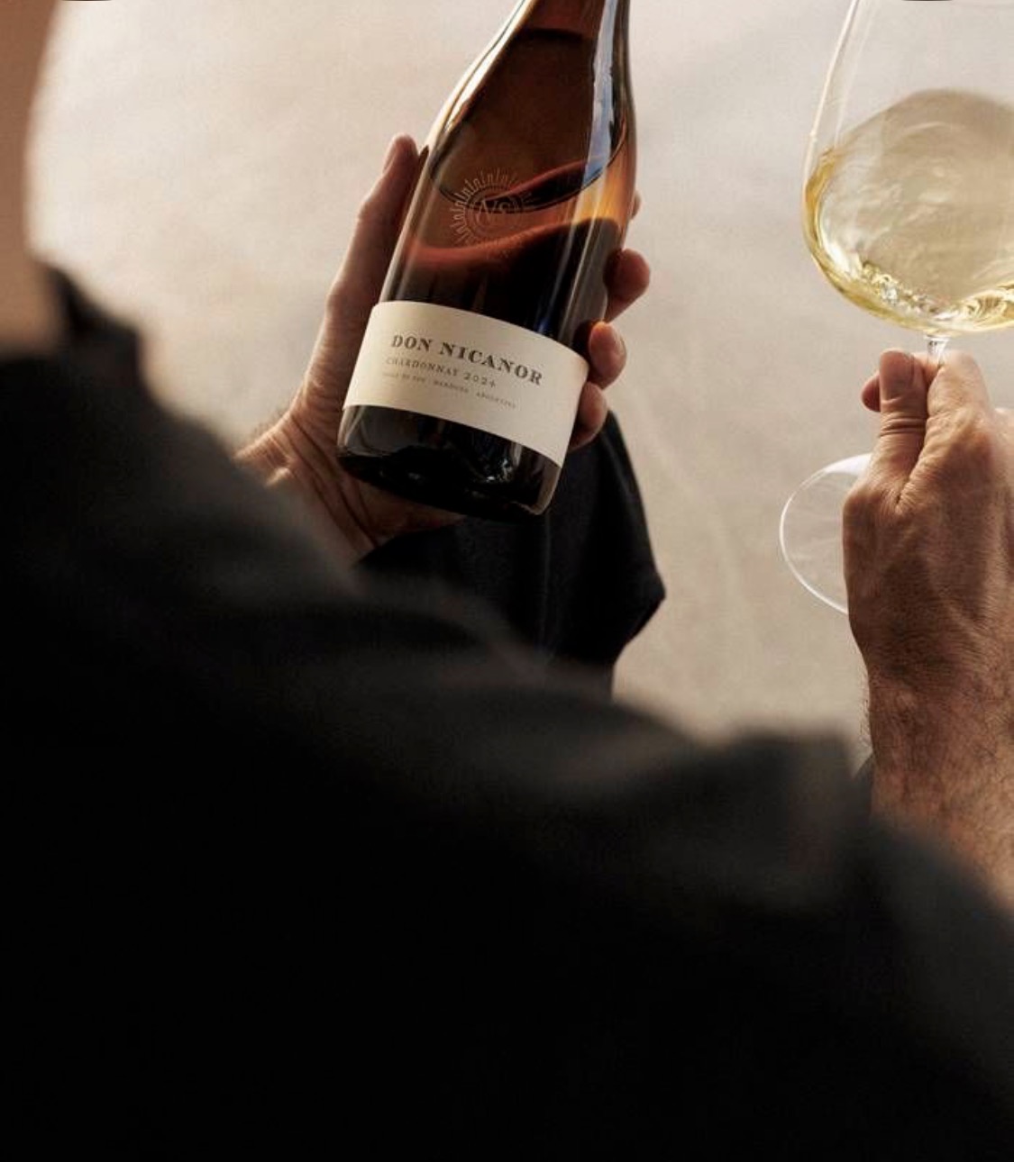 A glass of chardonnay and a bottle of Don Nicanor poured at an NZR wedding service.