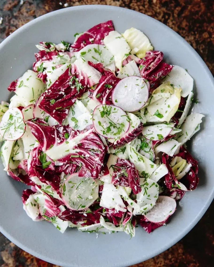 Radicchio and endive salad with shaved radish, dill, parsley, and grana.