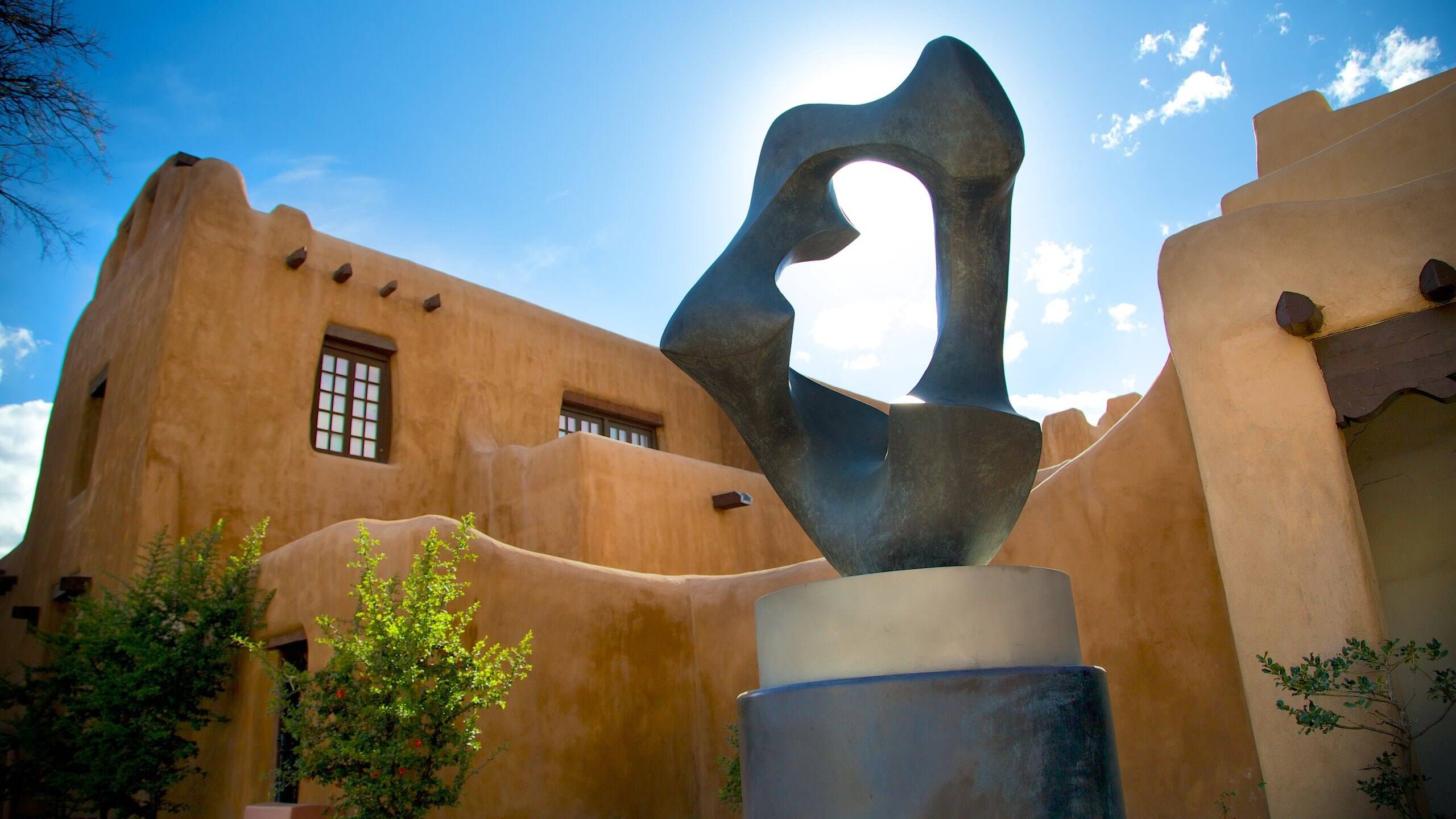 New Mexico Museum of Art adobe architecture with sculpture, Santa Fe.