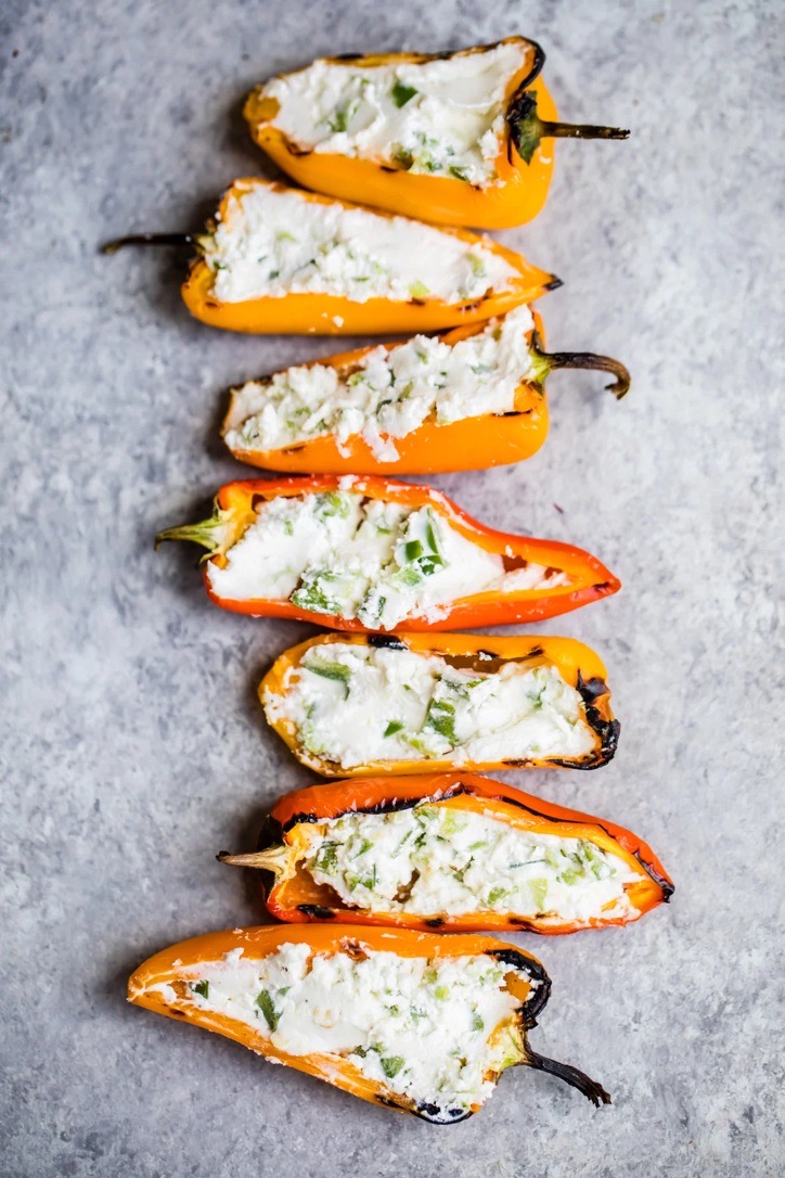 Fire-grilled mini sweet peppers stuffed with herbed goat cheese.