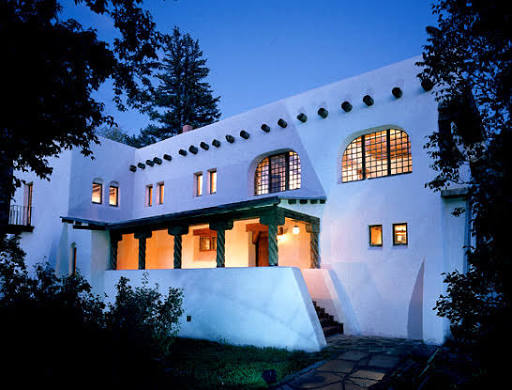 The Taos Art Museum at Fechin House — adobe artist's home glowing at twilight, Taos.